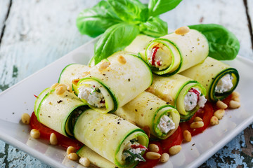 zucchini rolls with feta cheese and pine nuts