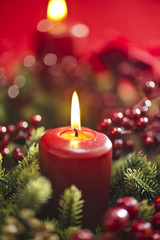 Obraz na płótnie Canvas Advent wreath over red background