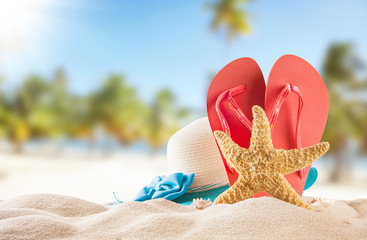 Fototapeta na wymiar Summer beach with red sandals and shells