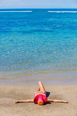 Woman relaxing on tropical beach