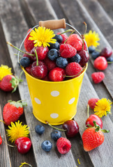 Fresh summer berries in a bucket