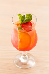 cocktail with orange and strawberry