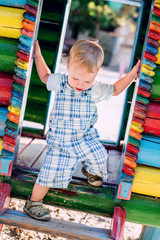 Fototapeta na wymiar descends toddler boy at the playground