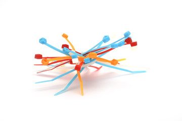 Colored cable ties on white background