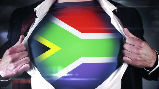 Businessman opening shirt to reveal south african flag
