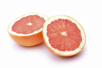 Naklejka na ściany i meble Slices of grapefruit on a white background.