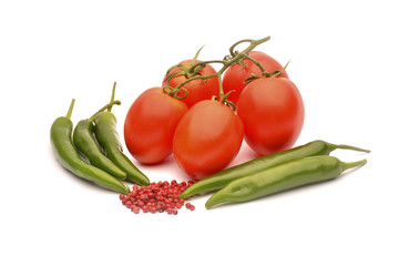 Tomatoes, chilli and pepper on white background