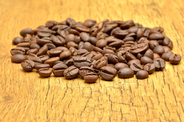 Coffee beans on old wooden background