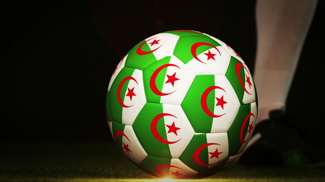 Football player kicking algeria flag ball
