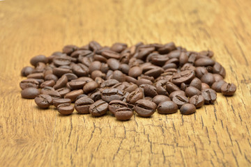 Coffee beans on old wooden background