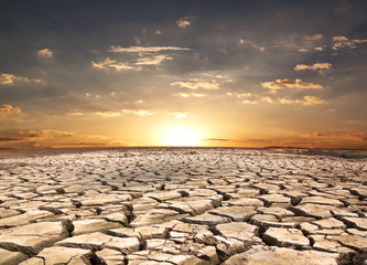 Drought land against sunset