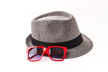 Hat , sunglasses isolated on white