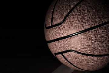 Basketball on court black background with light effect