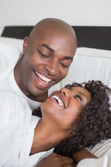 Fototapeta premium Happy couple lying in bed together