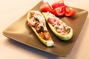 Zucchini stuffed with mixed vegetables