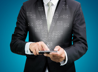 Businessman standing posture hand hold mobile phone send mail is