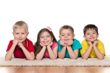 Happy children on the white carpet