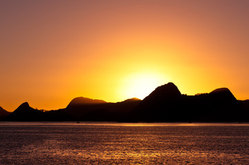 Naklejka na ściany i meble Sunrise in Rio de Janeiro with mountains in the Horizon