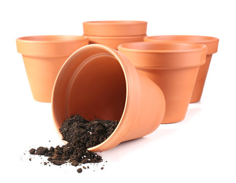 Clay flower pots and soil, isolated on white