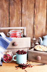 Dried hibiscus tea in color mug, brown sugar  in box