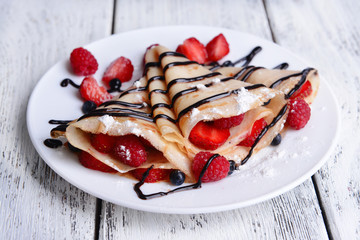 Delicious pancakes with berries on table close-up - obrazy, fototapety, plakaty