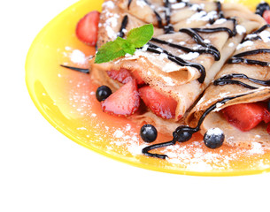 Delicious pancakes with berries isolated on white
