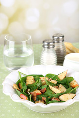 Green salad with spinach, apples, walnuts and cheese  table,