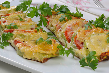 Baked zucchini with tomatoes and cheese