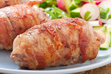 Grilled meat rolls wrapped in strips of bacon