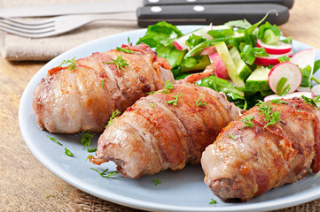 Grilled meat rolls wrapped in strips of bacon