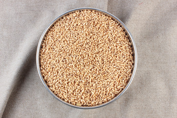 wheat in bowl & outside bowl isolated