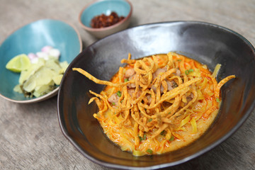 Noodle Khao soi , Thai food on wood background