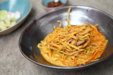 Noodle Khao soi , Thai food on wood background