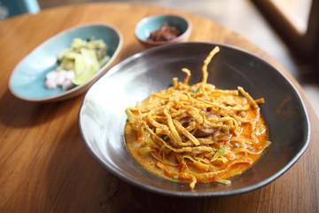 Noodle Khao soi , Thai food on wood background