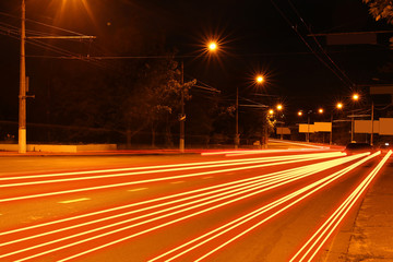 Moving car with blur light through city at night