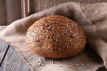 Fresh bread on wooden table, close up
