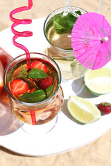 Delicious cocktails on beach, close-up