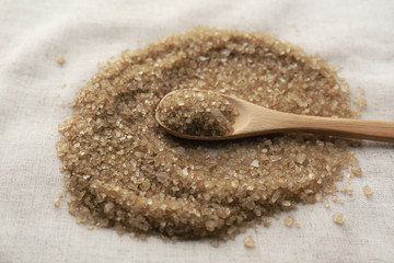 Sea salt in wooden spoon, close up