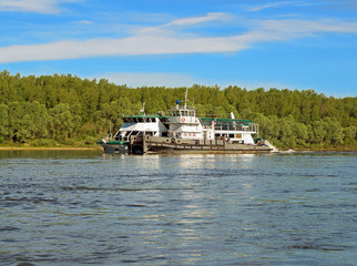Tug transports river vessel