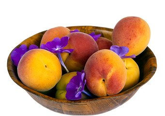 Apricots in a wooden bowl isolated
