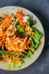 Healthy salad with carrot,almond and cheese