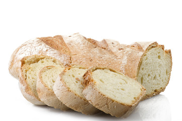 Homemade bread sliced close up on white