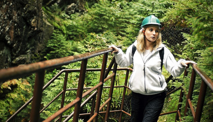 Beautiful girl in helmet walking in canyon © wrzesientomek