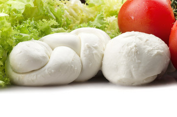 Mozzarella tomatoes and fresh salad on the white