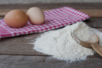 Wooden spoon with flour