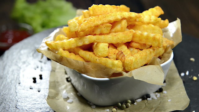 Portion of rotating French Fries (loopable full HD video)