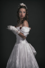 Naklejka premium Victorian fashion woman wearing white dress. Holding porcelain t