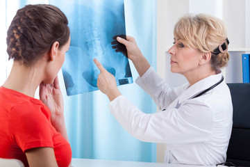 Doctor showing patient test results