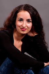 brunette on a gray background