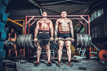 Powerlifter with strong arms lifting weights